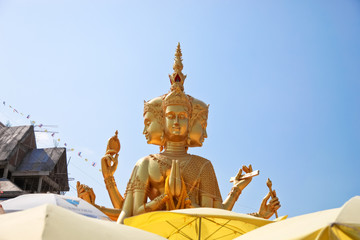largest brahma statue against blue sky at Wat Samaesan.