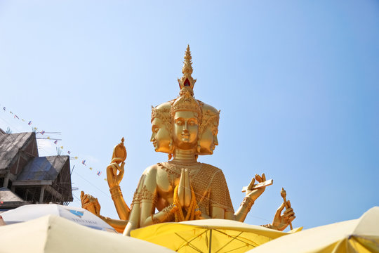 largest brahma statue against blue sky at Wat Samaesan.