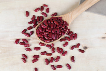 red beans in a wooden spoon