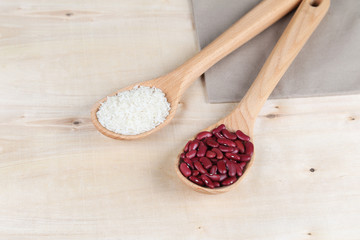 red beans and rice in a wooden spoons