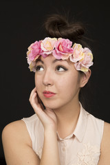 Beautiful brunette teen girl model wearing a floral crown