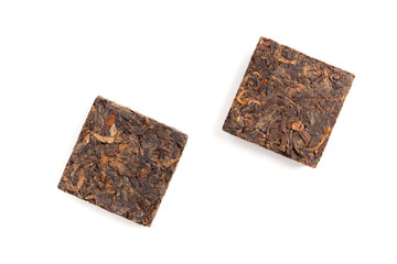 Two pressing briquette of black Chinese Pu Erh tea