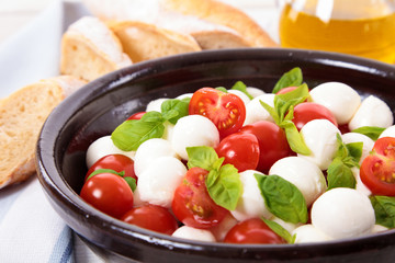 Caprese salad with mozzarella, tomato and basil