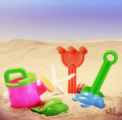 Fototapeta na wymiar toys for childrens sandboxes against the sea and the beach