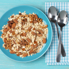 Oatmeal flakes with nuts in plate