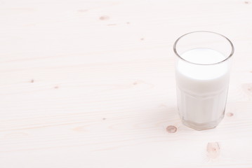 milk in glass containers on a table top view