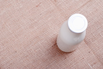 milk in glass containers on a table top view