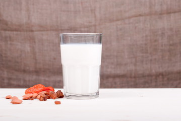 milk, almonds, raisins, dried apricots on the table side view