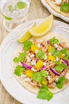 Tacos for lunch with chicken, pineapple salsa, purple onion and
