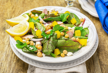 Assorted salad with arugula, spinach, chard, chicken, white