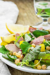 Assorted salad with arugula, spinach, chard, chicken, white
