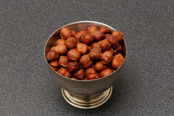 hazelnuts in metal bowl