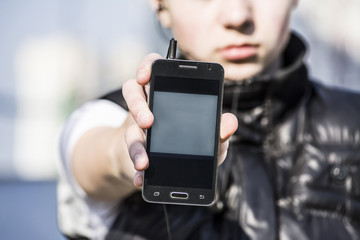 Teenager holding a phone, write text