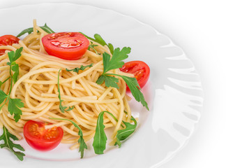 Tagliatelli pasta with tomatoes and basil.
