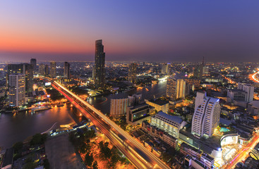 River in Bangkok city with high office building in night time