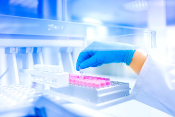 Scientist holding sample in laboratory, hospital details