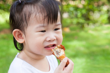 Closeup little asian (thai) girl enjoy eating her lunch