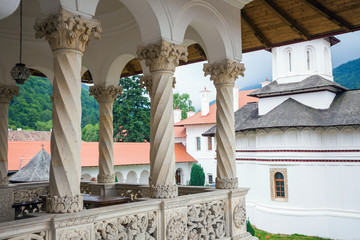 Obraz na płótnie Canvas Church inside Sambata de Sus Monastery seen trough a colonade in