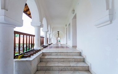 Arched colonade hallway at Sambata de Sus monastery in Transylva