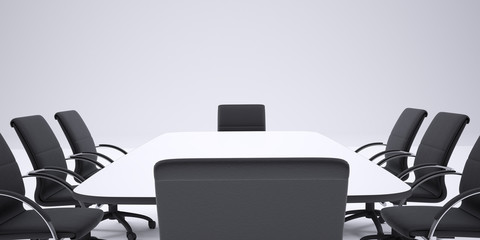 Conference table and black office chairs. Cropped image
