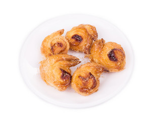 Croissants or crescent rolls on a plate.