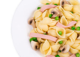 Pasta shells with vegetables and sausage.