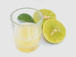 Close up lemon juice with  sliced lemon