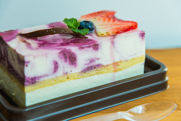Blue berry cheese cake on wooden plate