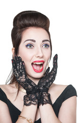Excited young beautiful girl in retro pin up style isolated
