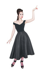 Naklejka premium Young beautiful woman in retro pin up style showing on something