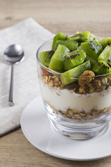 Granola, yoghurt and kiwi