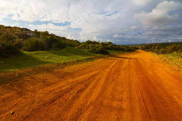 Fototapeta na wymiar red clay rural road