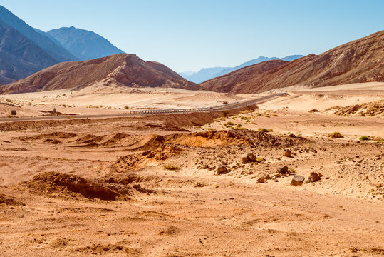 Panoramic view of road through desert with mountains,  Egypt