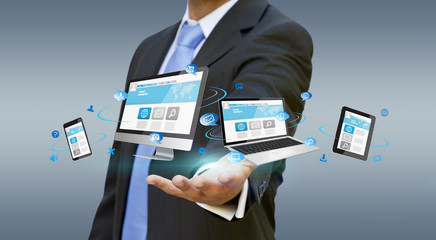 Businessman holding tech device in his hand