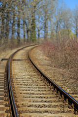 Obraz premium Scenic railroad in spring in remote rural area -selective blur