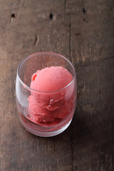 red homemade ice cream scoops in a clear glass