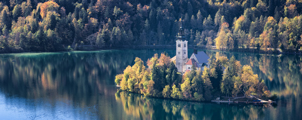 church in autumn on the lake in Slovenia