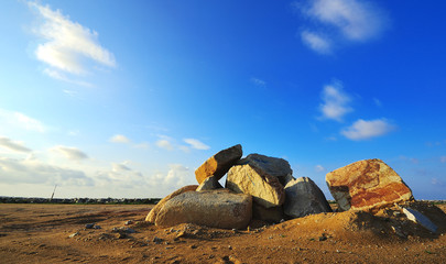 Big boulder stone with sky blue background © norazaminayob