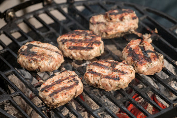 Grilling meat balls on barbecue grill