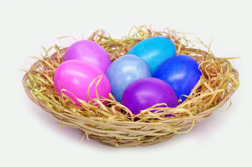 Fototapeta na wymiar Basket with colorful easter eggs