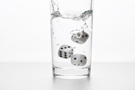 Dices In A Glass Of Water