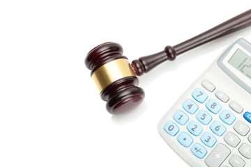 Wooden judge's gavel and neat calculator next to it