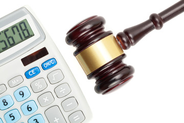 Judge's gavel and calculator. Studio shot over white