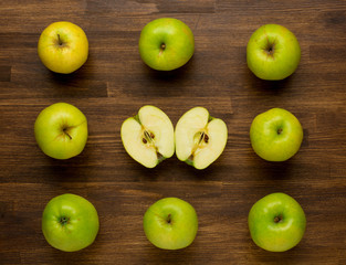 Green ripe Apples on wooden background