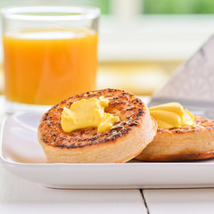 Hot fresh breakfast crumpets with butter melting on top