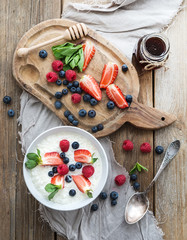 Healthy breakfast set. Rice cereal or porridge with berries
