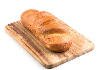 Bread loaf on a wooden chopping board
