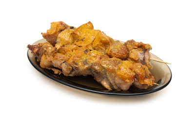 Grilled chicken on bamboo skewers on a white background