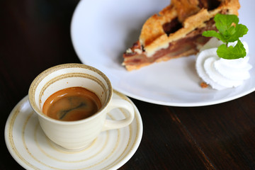 Fresh coffee on wooden table. Espresso coffee short on table.
