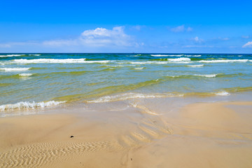 Fototapeta na wymiar Waves on Baltic Sea beach near Leba, Poland